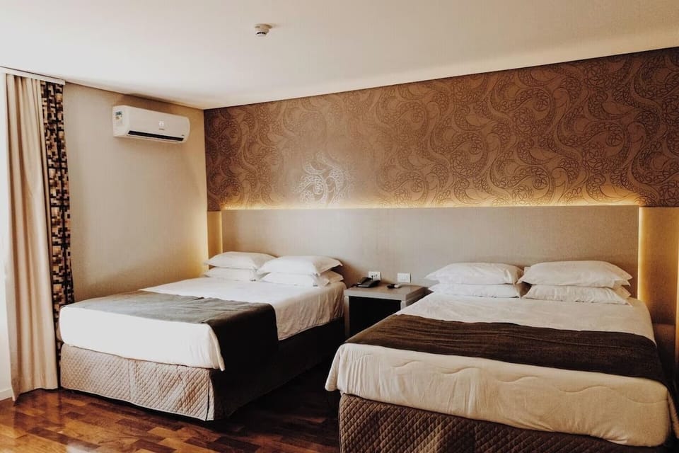 Rest easy in a cozy twin setup with warm tones.