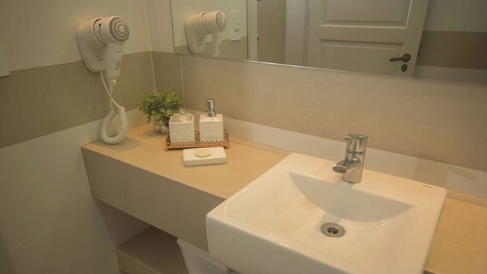 Refresh at a spotless vanity with essentials neatly prepared