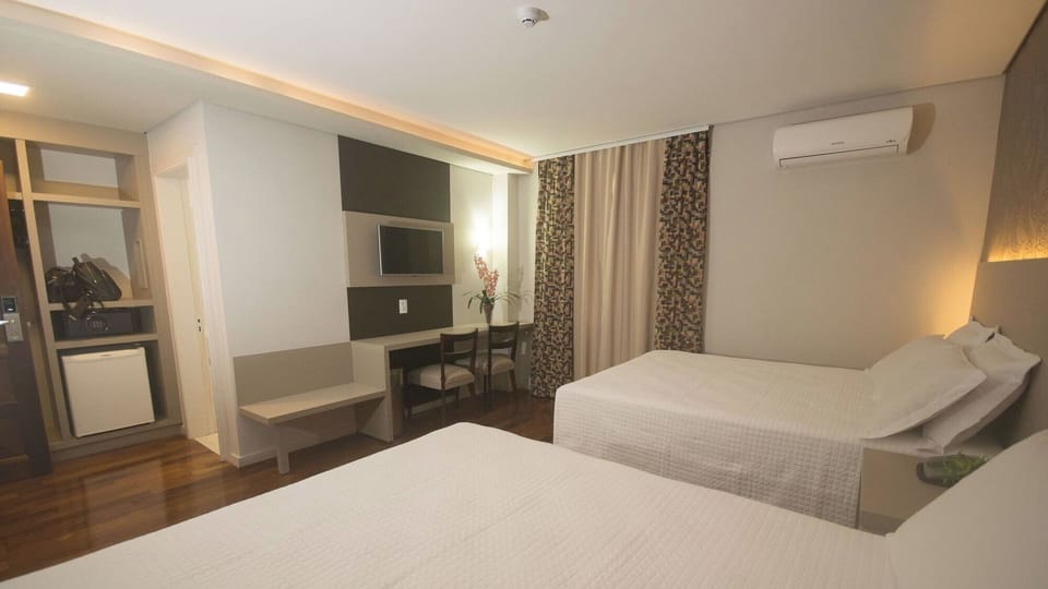 Make yourself at home with workspace, TV, and ample storage.