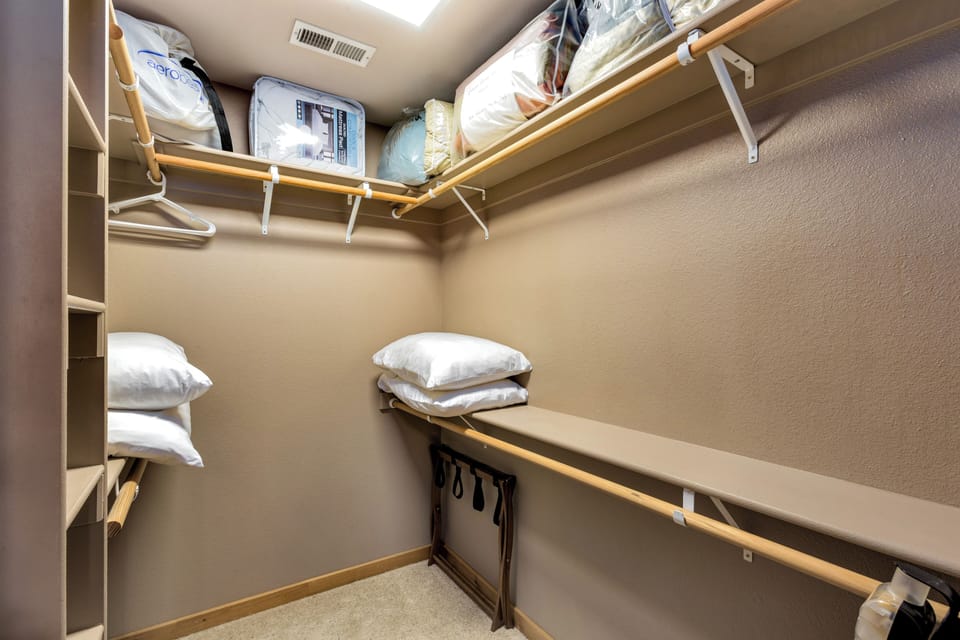 Primary bedroom walk-in closet.