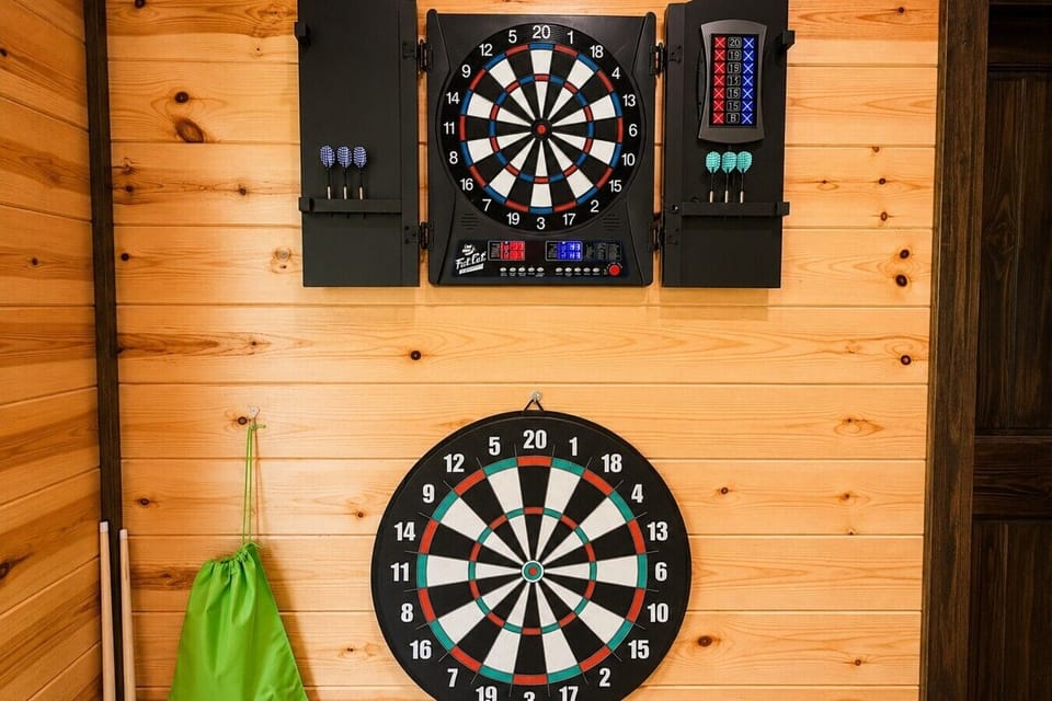 Indoor dart game setup with classic and electronic scoring boards