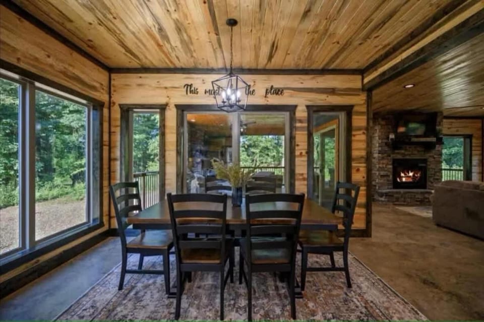 Spacious dining table with natural light & cozy wood cabin charm