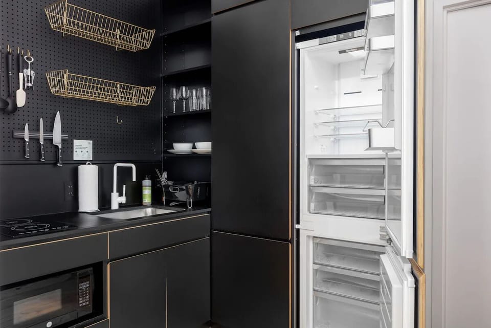 Cook with ease in the sleek kitchenette with full-size fridge.
