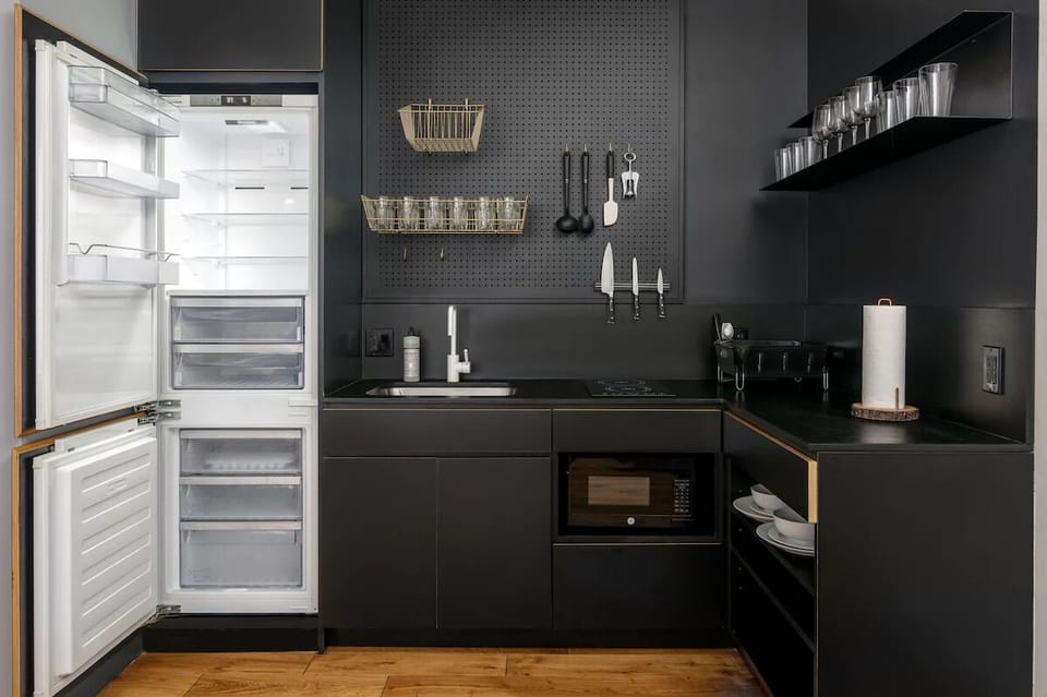 Prep easy meals in a sleek kitchen with full-size fridge