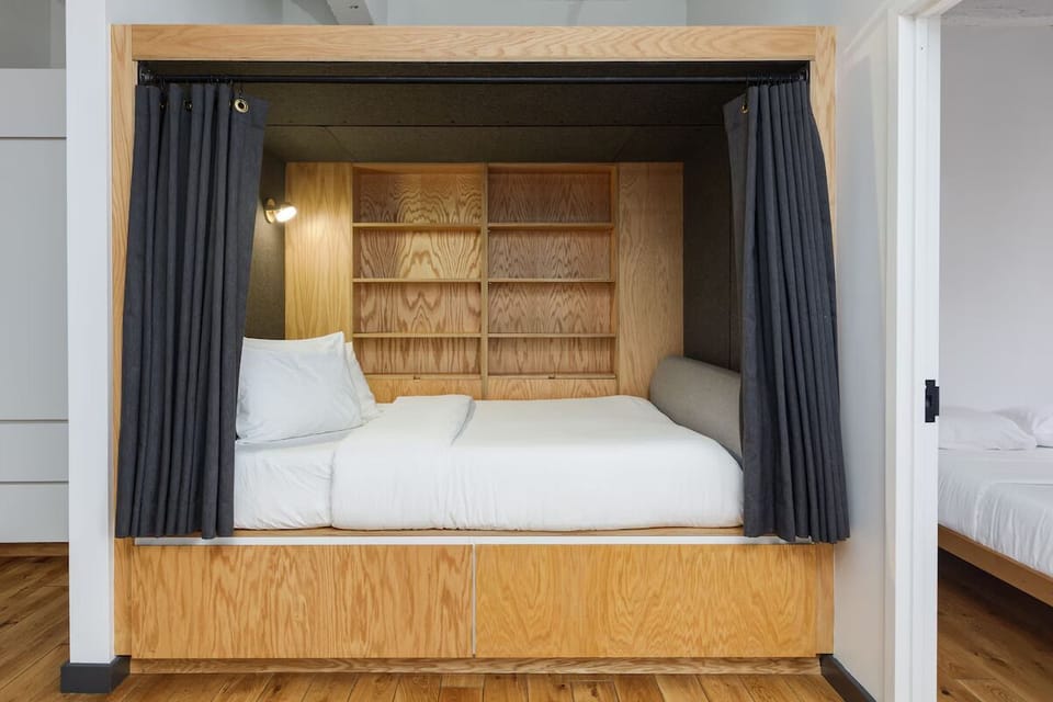 Close the curtains and drift off in a private sleep nook.