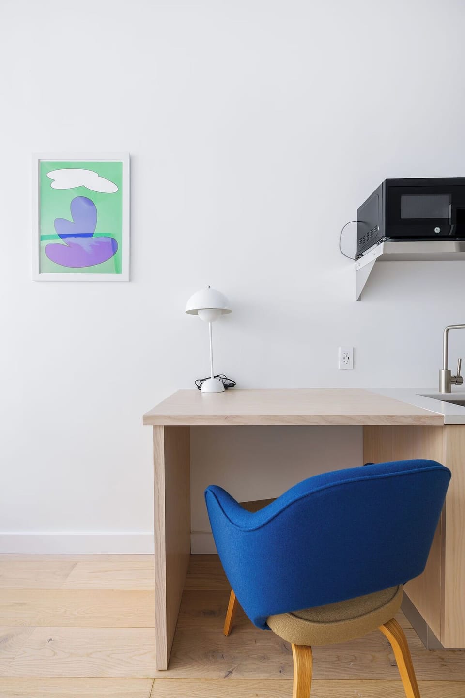 Settle into a cozy work perch beside the kitchenette.