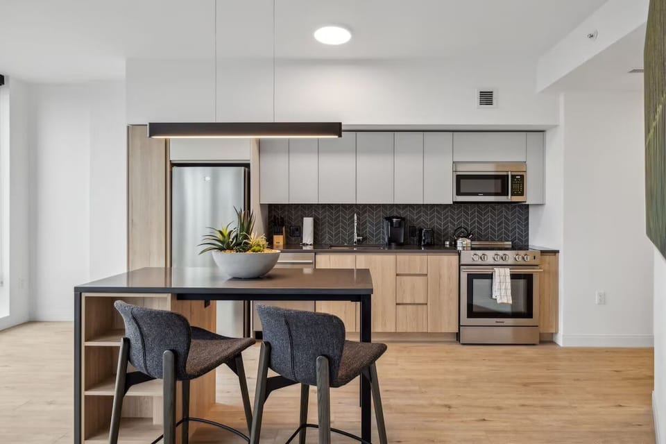 Cook with ease in the sleek kitchen with stainless appliances.