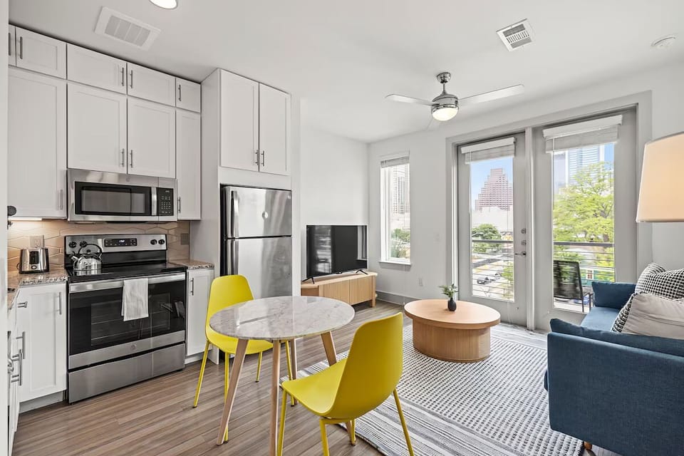 Gather for meals in a sleek, open-plan kitchen.