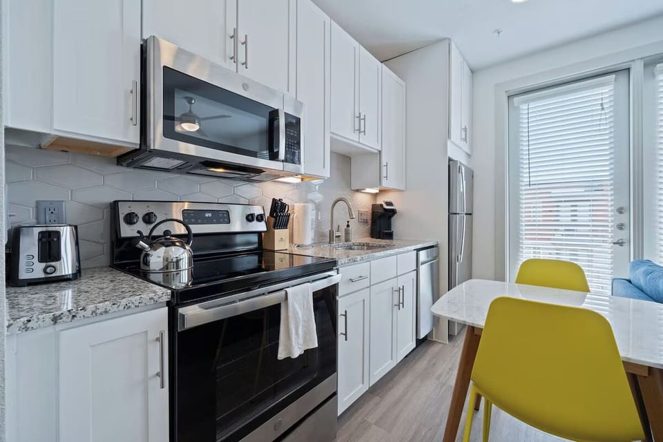 Sip morning coffee at the dining table steps from the kitchen.