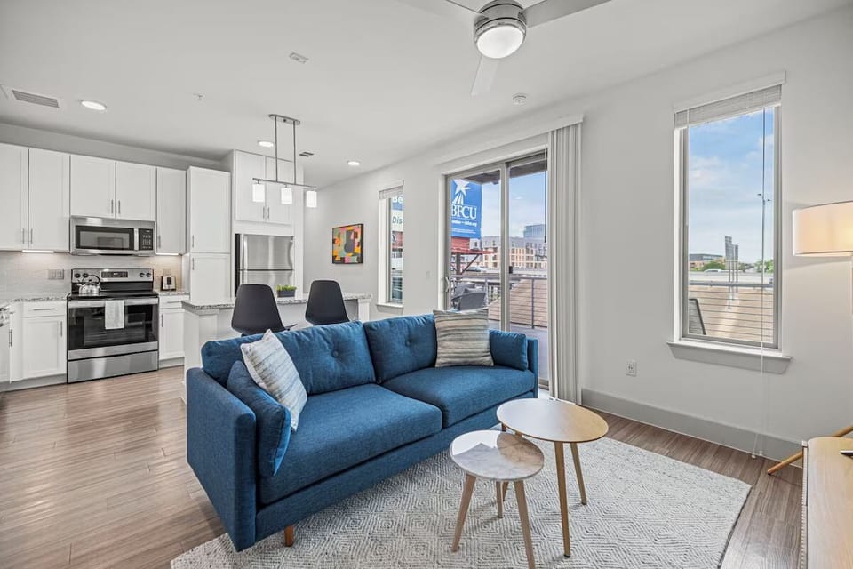 Lounge comfortably while the sleek kitchen keeps everyone connected.
