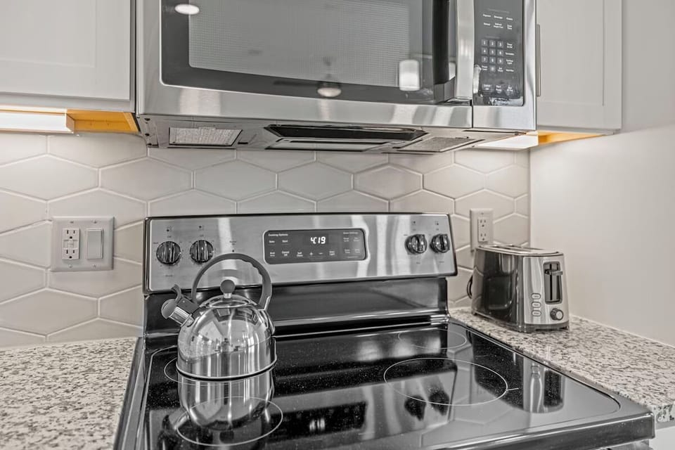 Brew tea and toast breakfast with modern stainless appliances.