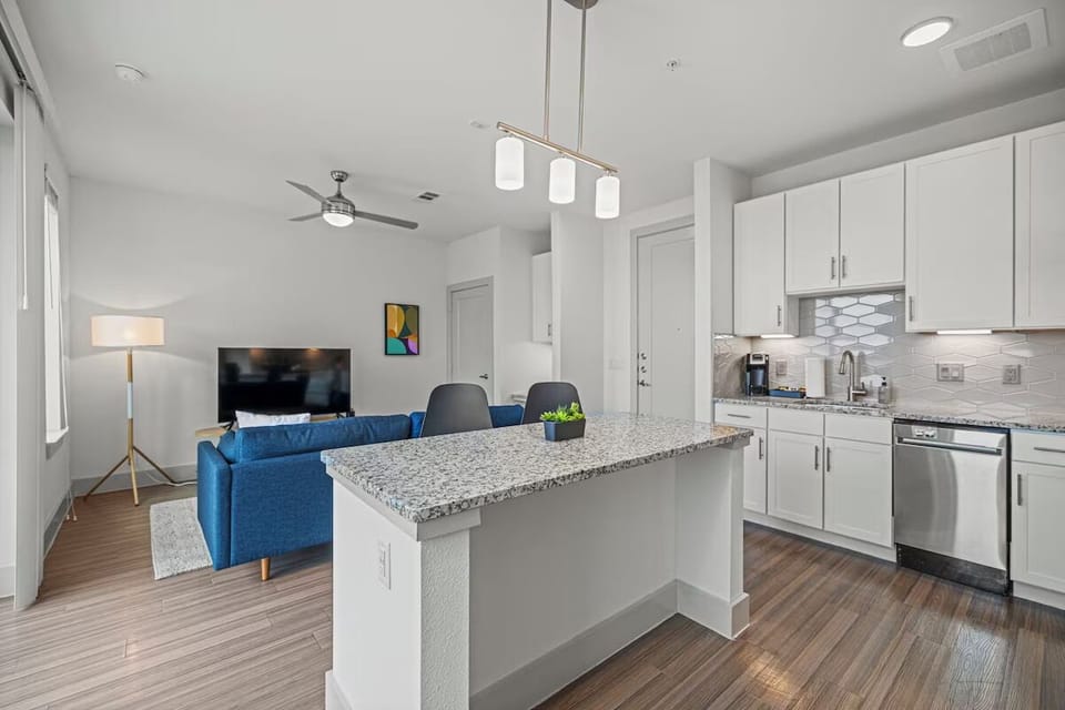 Serve meals effortlessly from the bright island into the lounge.