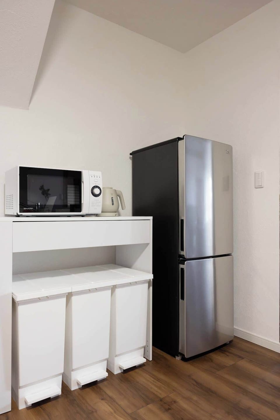 fridge, microwave, and hot water kettle.