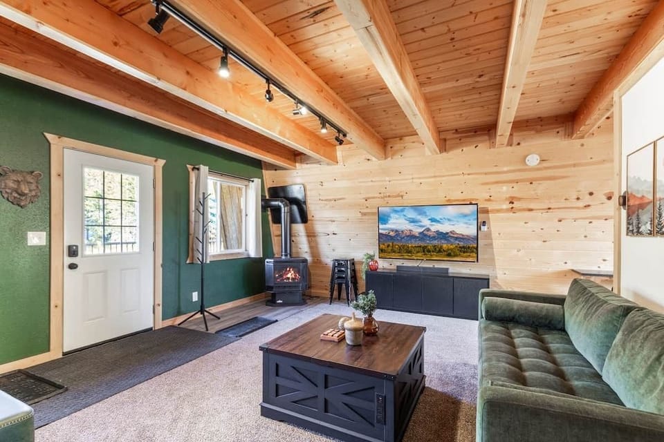 Spacious living space with stools to sit around the coffee table for games. 2 queen sofa beds. Propane fireplace with smart thermostat. Smart Roku tv for streaming. 