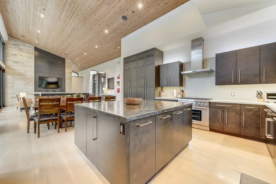 Dual fridges, stainless appliances, and prep space galore make cooking for a group effortless.
