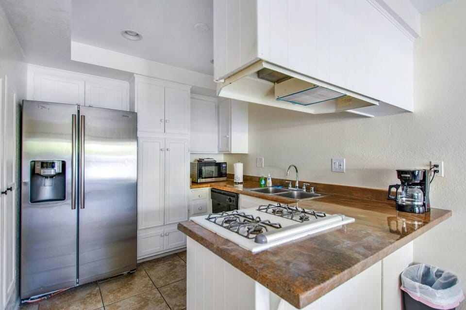 Modern kitchen with full-size appliances, perfect for home-cooked meals.