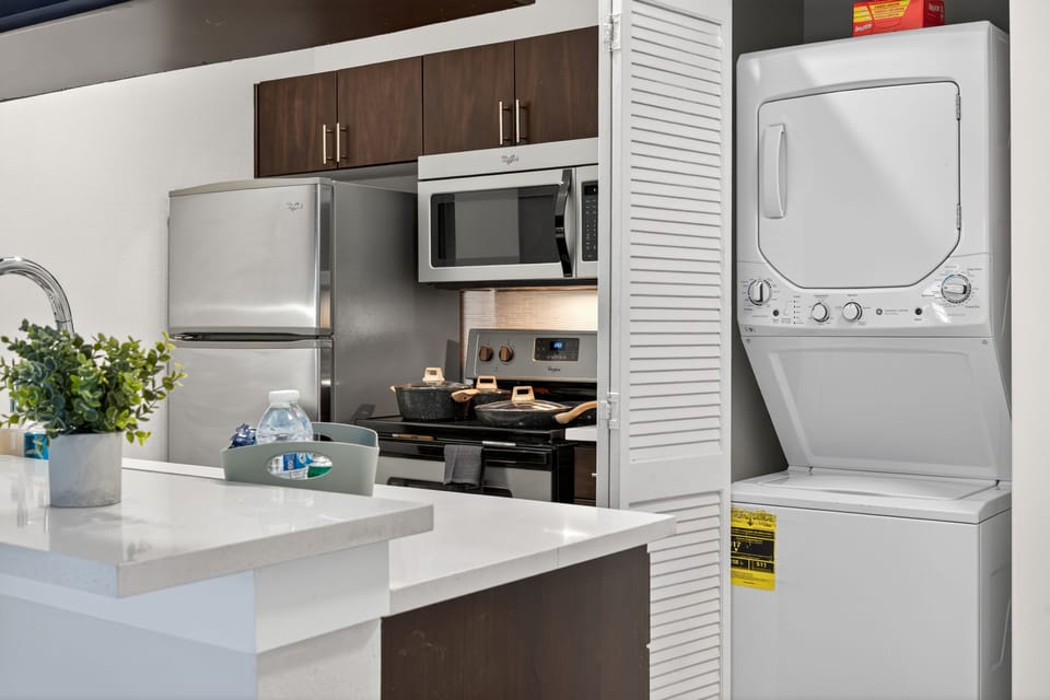 Modern convenience with a full washer and dryer.