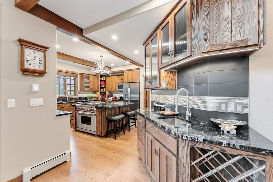 Kitchen: Drip coffee maker, Crockpot, blender, toaster, cooking utensils, tableware