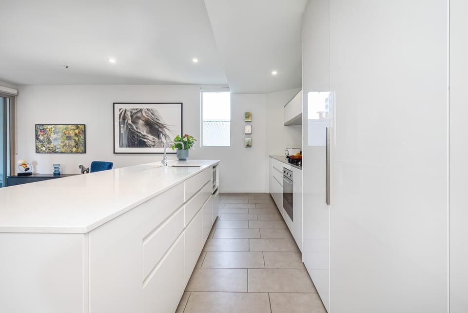 Contemporary kitchen with Stone Benchtops and Smeg appliances