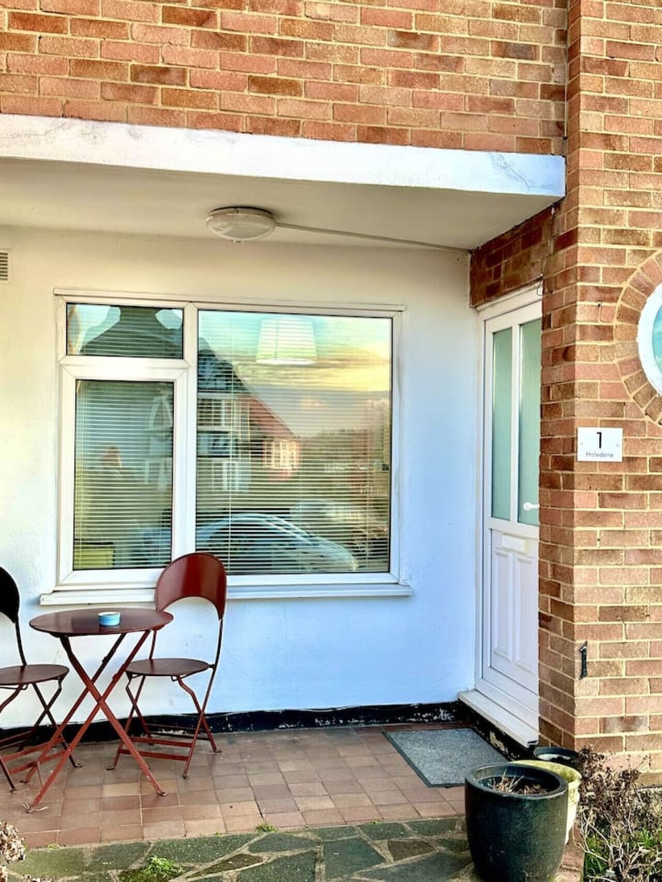 Entrance patio with bistro table and chairs