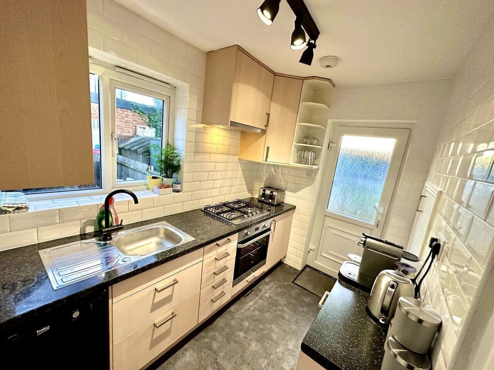 Bright kitchen with ample counter space and rear access