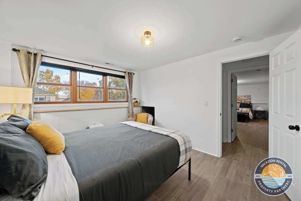 Clean and comfortable bedroom on lower level with ample natural light - restful space for 2