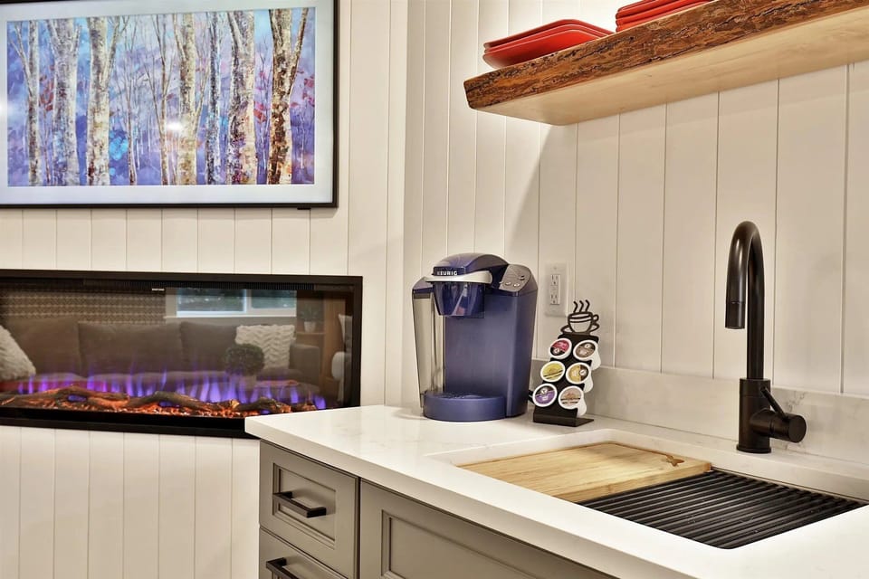 Sleek kitchenette with a 2-burner cooktop and Keurig. Perfect for morning coffee or a light après-ski meal.