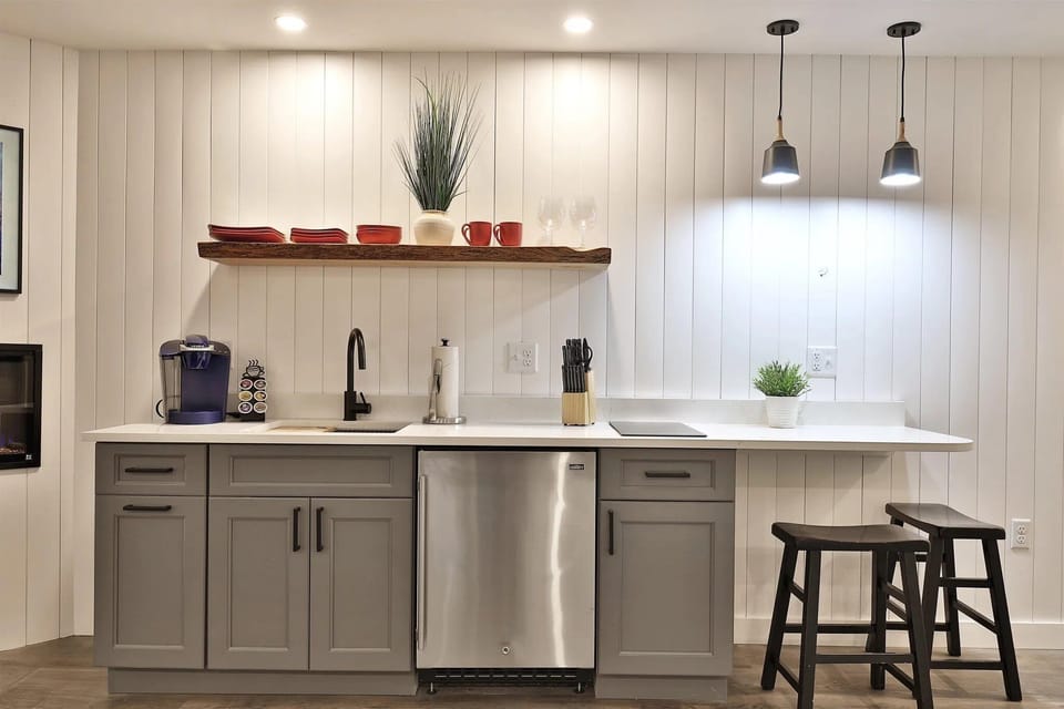 Sleek kitchenette with a 2-burner cooktop and Keurig. Perfect for morning coffee or a light après-ski meal.