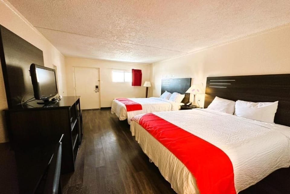 Bedroom, TV, mini fridge, and a microwave