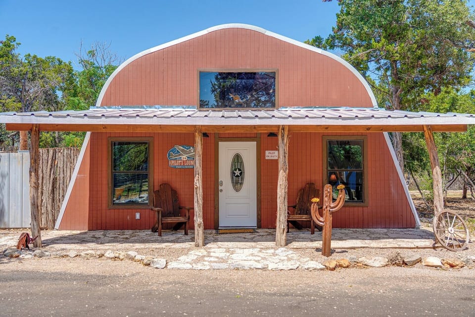 Charming Entrance: Enjoy a unique exterior with rustic charm and inviting seating!