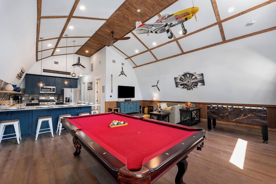 Game Room: Unleash your competitive spirit with pool, foosball, and stunning décor!