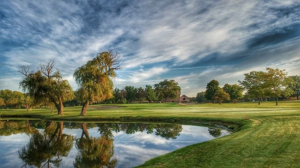 Unwind beside tranquil greens and water views near the hotel.
