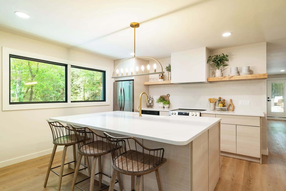 Cook, connect, and sip at this bright and breezy chef’s kitchen with a view