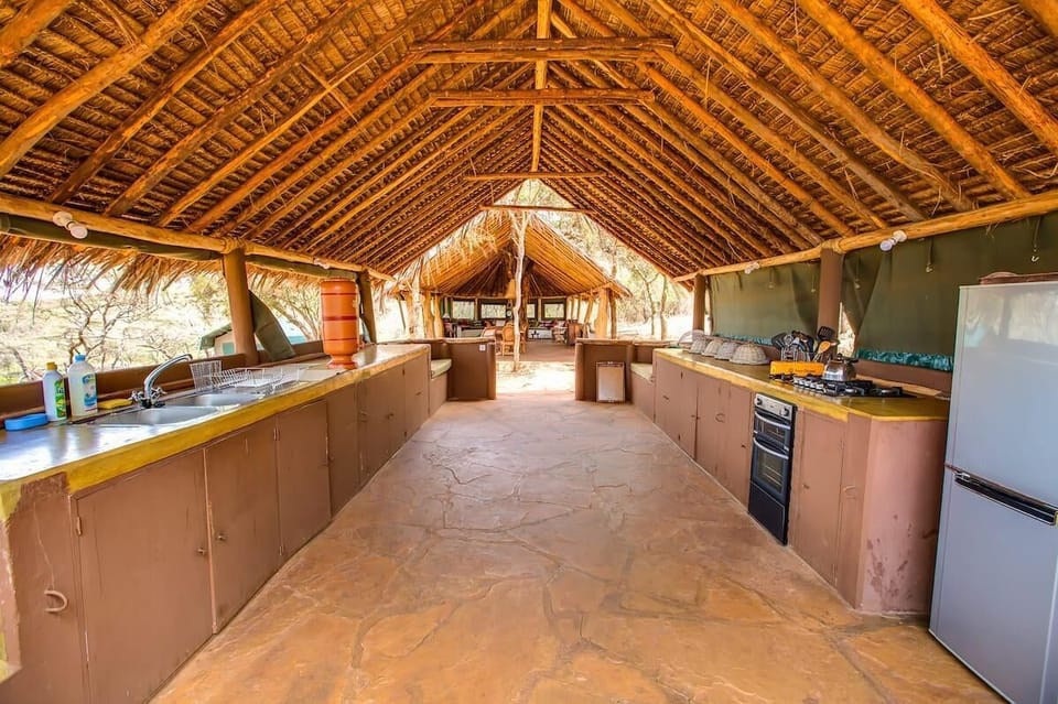 Fully-Equipped Kitchen With Solar-powered fridge, freezer, hob, oven, gas, kettle,