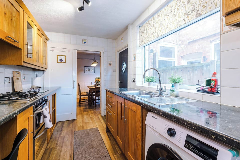 The long kitchen features a washing machine, oven, toaster, kettle and microwave and is fully equipped with everything you need to cook meals away from home. The original banking vaults are even still there for you to admire!
