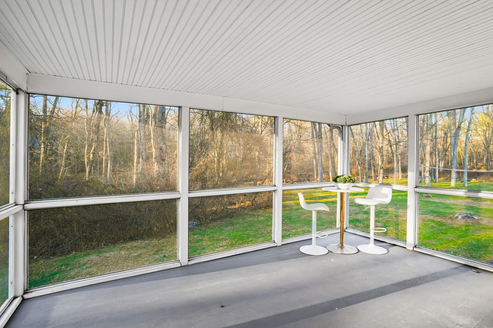 Screened in back deck! Little bistro with 2 seats to sit. 