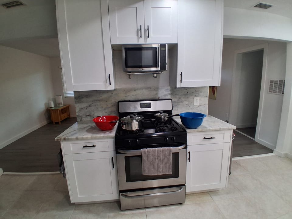 Kitchen with basic cooking supplies. 