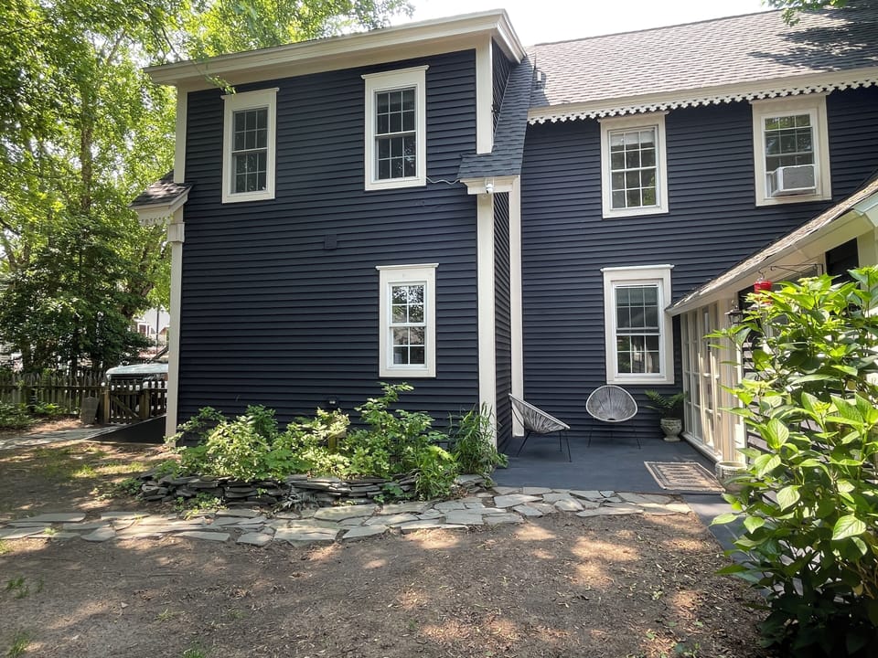 Large fenced in yard with shady quiet spots to sit and chat. 