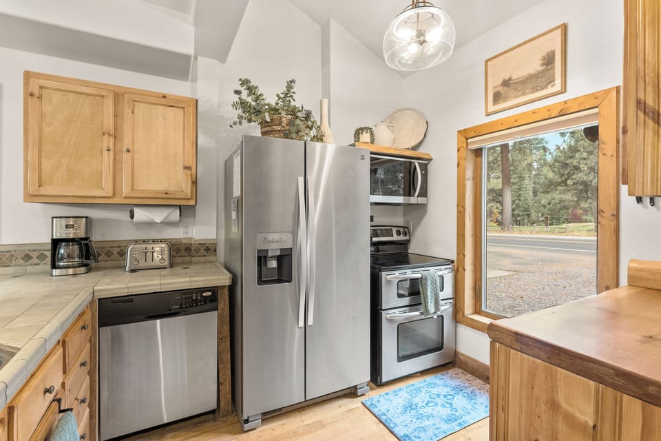 Our fully equipped kitchen is a culinary Delight with a drip coffee maker, dishwasher, breakfast bar and more! 