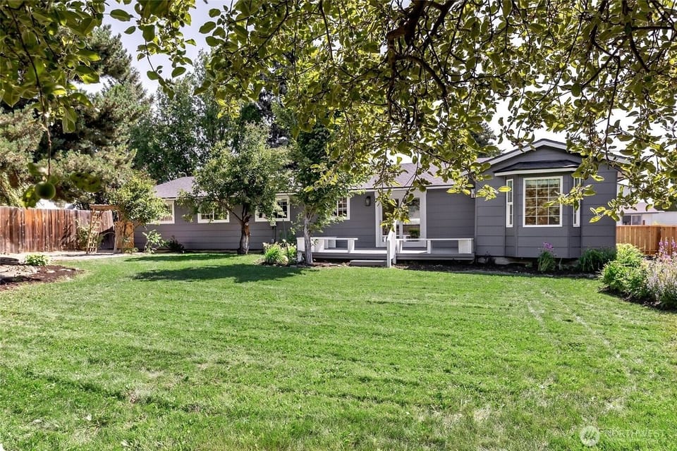 Spacious, fully fenced backyard with bbq and large deck.
