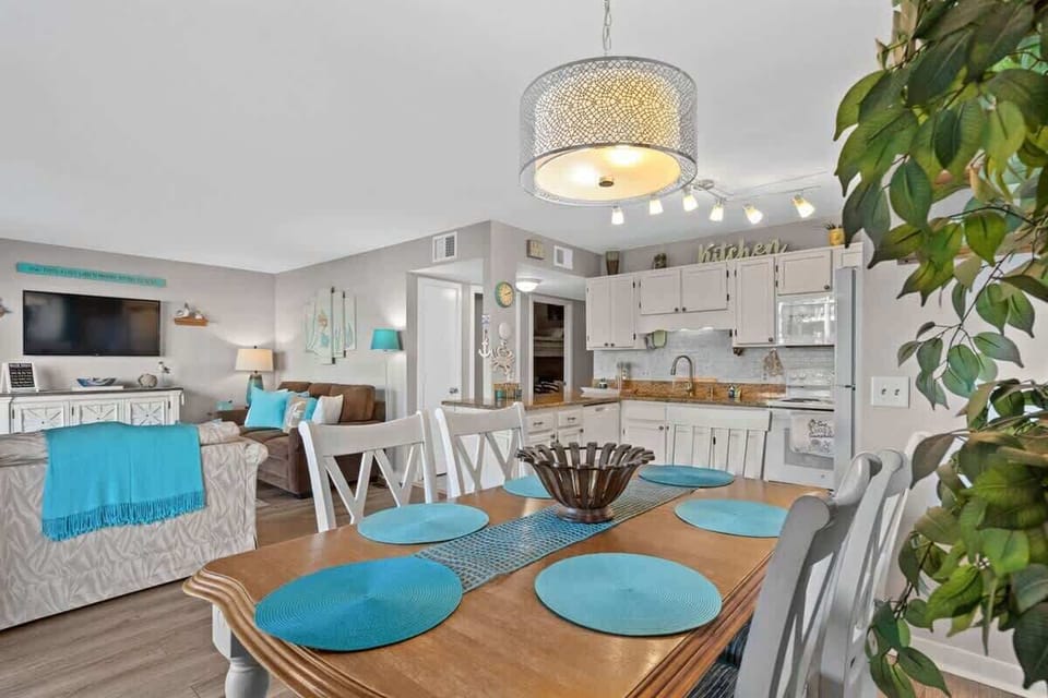 Dining table right by the kitchen. Forget the salt or napkin again? No biggie. Everything is just a step or two away