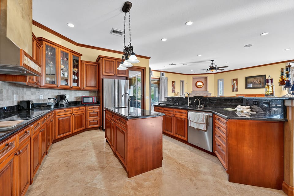 High-end stainless steel fridge, oven, and dishwasher for modern convenience.