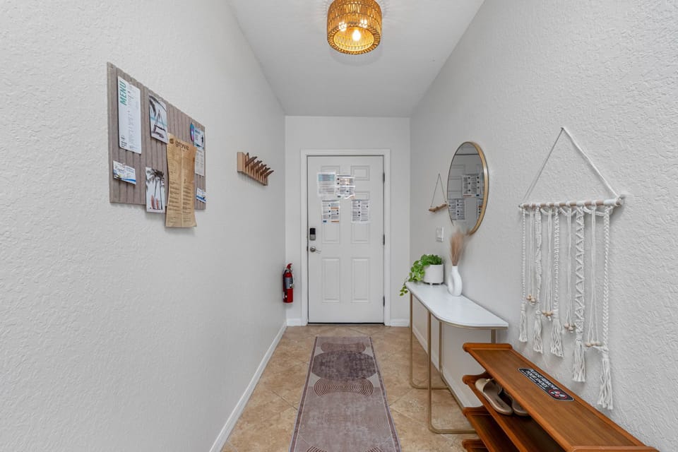 Hallway/Entry with all you need to know; shoe storage, hang up purses, beach bag