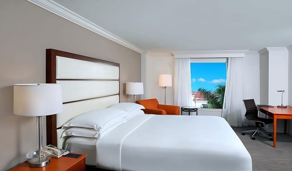 Sink into crisp linens and wake to bright skies.