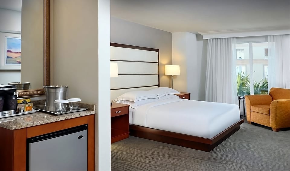 Settle in with in-room refreshments and a plush king bed.