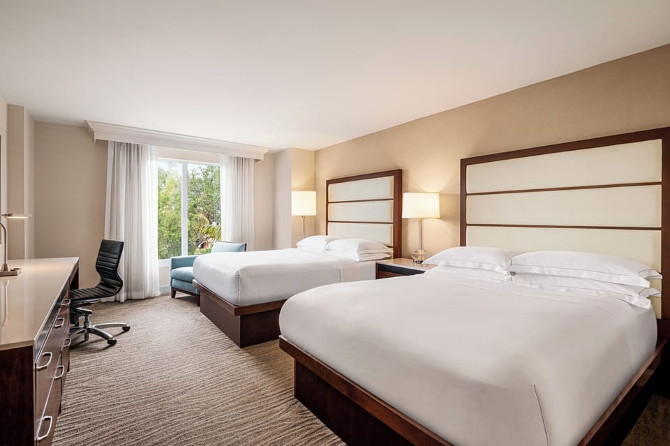Spread out comfortably with two beds and a cozy chair.