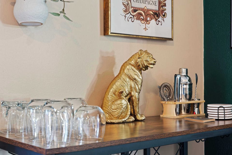 Bold design meets elegance—lion décor paired with sleek glassware.