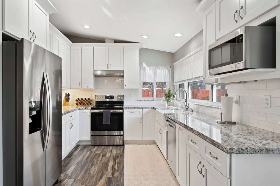 Fully equipped kitchen with modern appliances and ample counter space.
