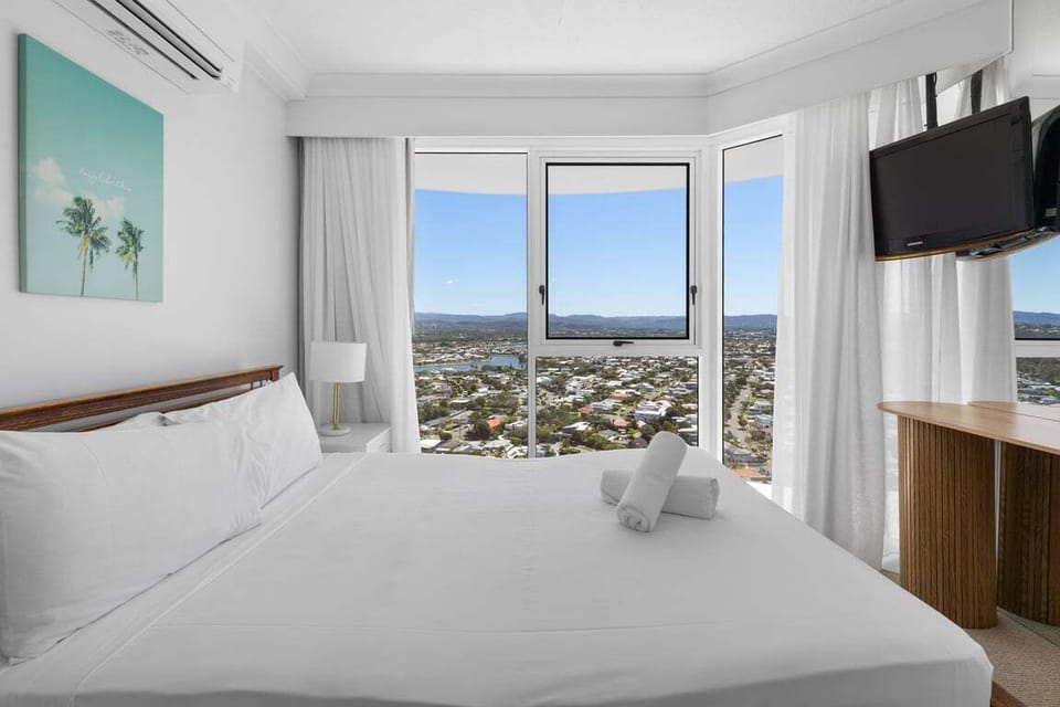 Comfortable sleeping space overlooking cityscape