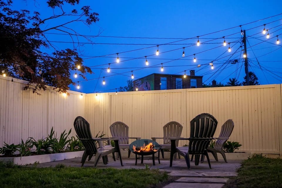 Unwind at night on the bluestone patio, perfect for bonfires under the lights in the heart of Kingston